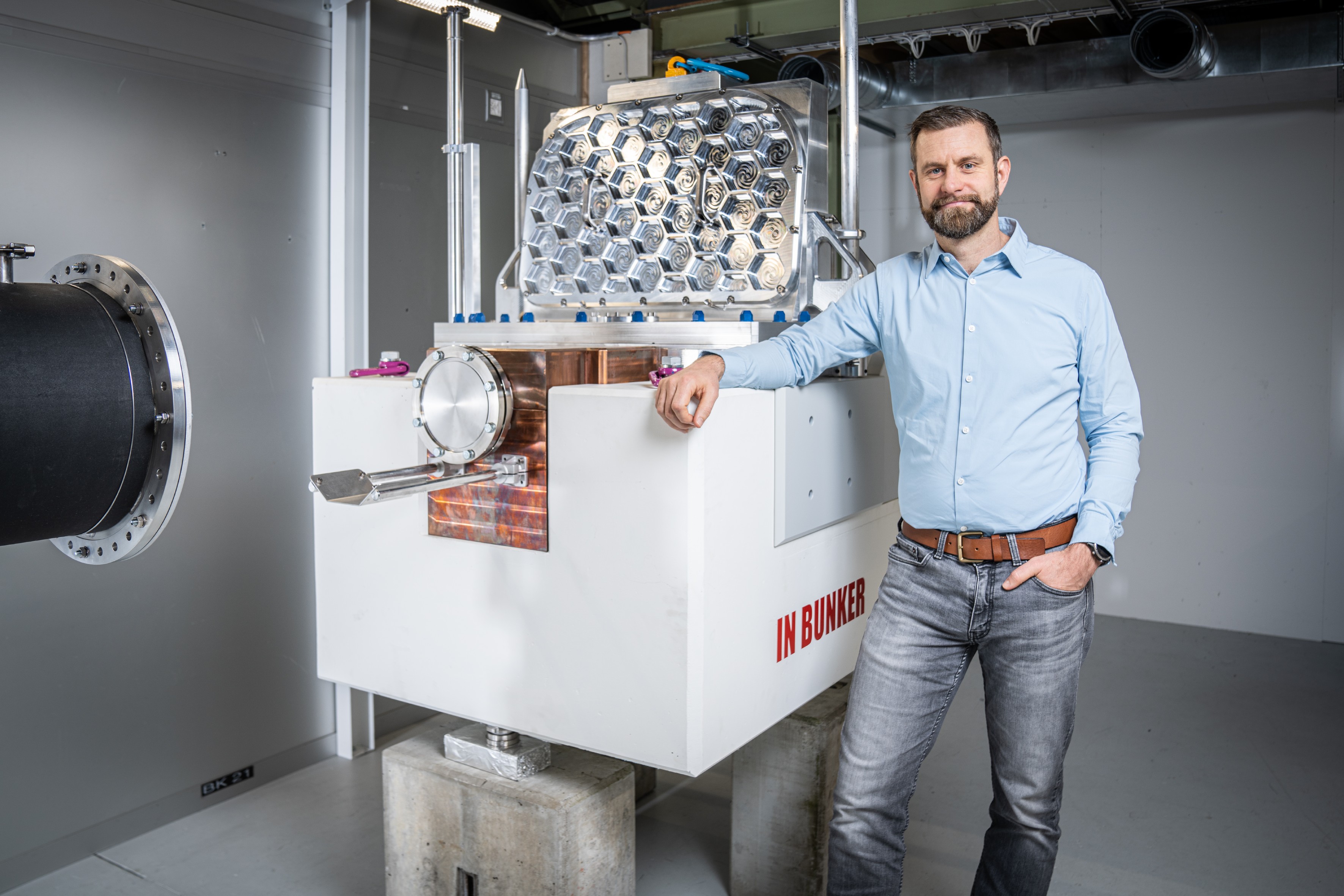 Marc Janoschek in front of ESTIA's Chopper Assembly